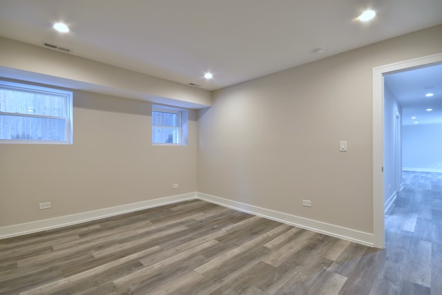 2123 N Austin Ave, Chicago, IL 60639 - below grade area with baseboards, recessed lighting, wood finished floors, and visible vents