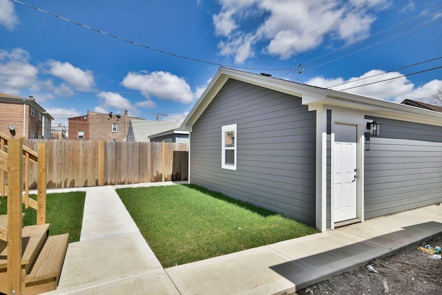 2123 N Austin Ave, Chicago, IL 60639 - view of side of property with a fenced backyard and a lawn