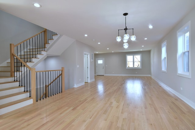 2123 N Austin Ave, Chicago, IL 60639 - interior space with recessed lighting, wood finished floors, stairway, and an inviting chandelier