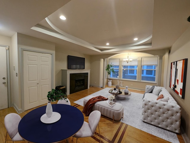 6912 N Lakewood Ave Unit 1W, Chicago, IL 60626 - living room featuring recessed lighting, a tray ceiling, a notable chandelier, and wood finished floors