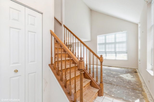 stairway with vaulted ceiling