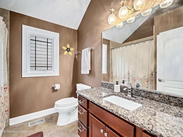 bathroom with vanity, toilet, tile patterned floors, baseboards, and visible vents