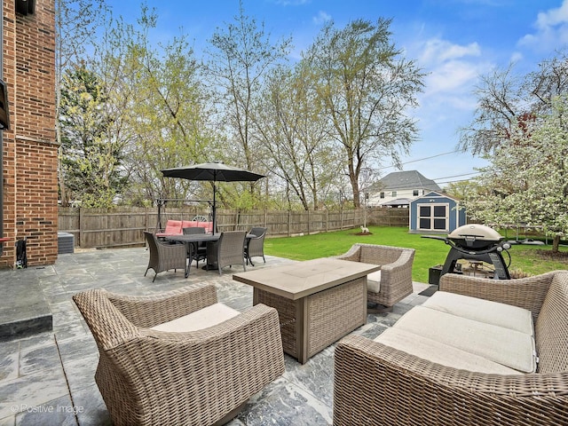 view of patio featuring an outdoor living space, a fenced backyard, and outdoor dining space