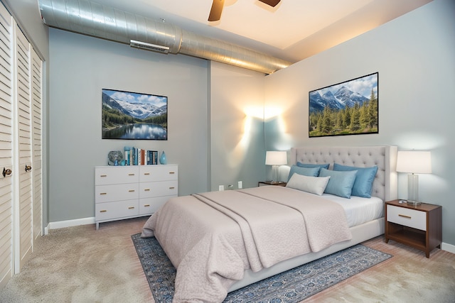 bedroom featuring baseboards, visible vents, ceiling fan, and carpet