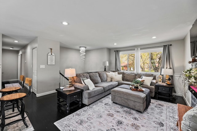 living room with recessed lighting, baseboards, and dark wood-type flooring