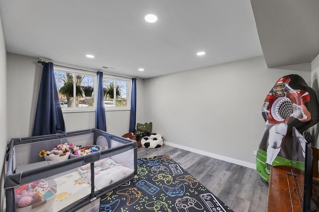 playroom with recessed lighting, baseboards, and wood finished floors