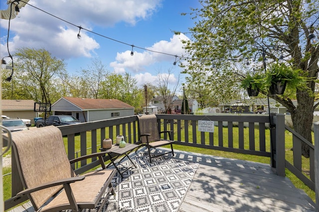 wooden terrace featuring a residential view and a yard