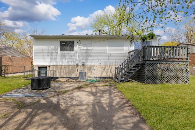 back of house with a deck, fence, a yard, a patio, and stairs
