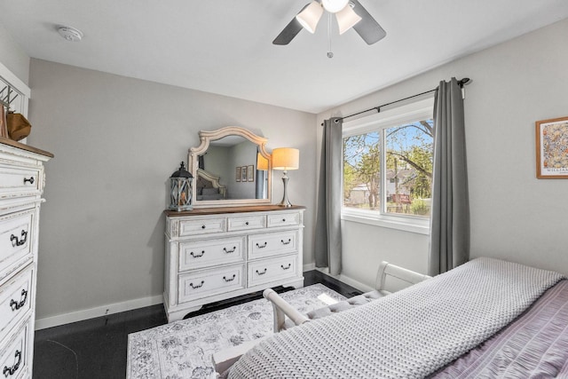 bedroom with baseboards and a ceiling fan