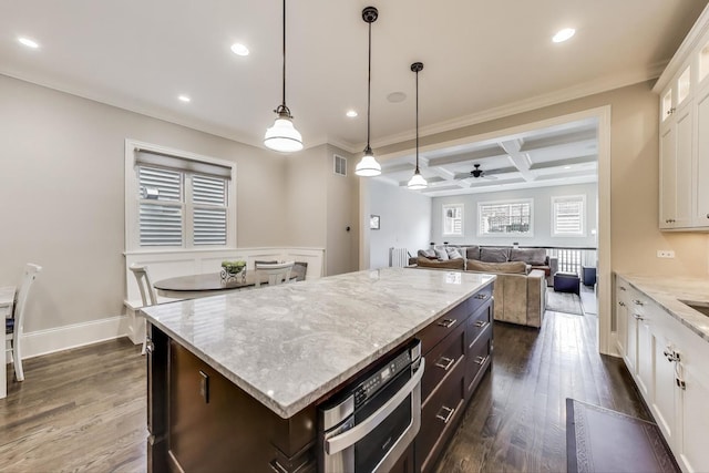 kitchen featuring coffered ceiling, white cabinets, glass insert cabinets, a center island, and dark wood-type flooring