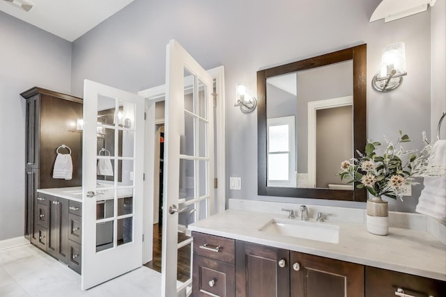 bathroom featuring vanity and french doors