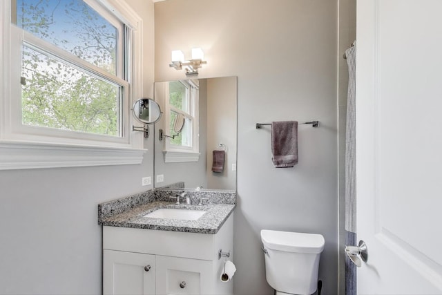 bathroom with vanity and toilet