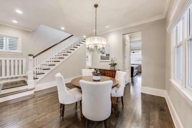 dining area featuring stairway, dark wood-style flooring, a chandelier, crown molding, and baseboards