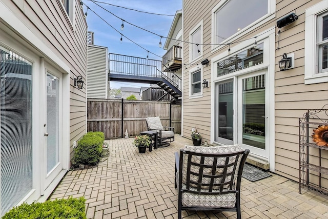 view of patio featuring fence