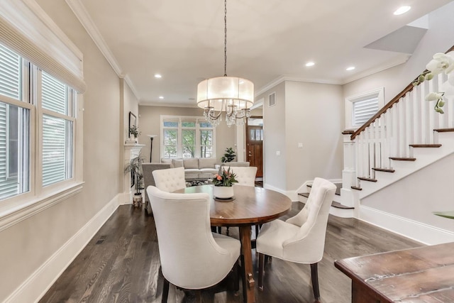 dining area featuring dark wood finished floors, crown molding, baseboards, stairs, and recessed lighting