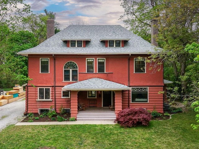 1314 E Washington St, Bloomington, IL 61701 - view of front of home featuring a shingled roof, covered porch, a chimney, and a front lawn