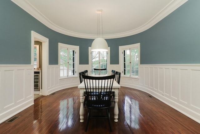 1314 E Washington St, Bloomington, IL 61701 - dining area with plenty of natural light, wainscoting, wood finished floors, and visible vents