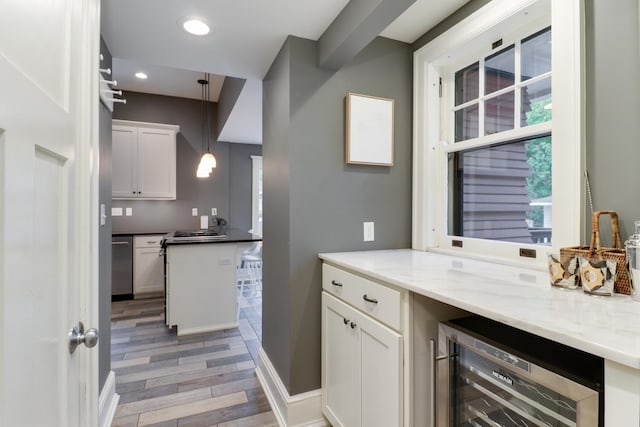 1314 E Washington St, Bloomington, IL 61701 - bar with hanging light fixtures, light wood finished floors, dishwasher, recessed lighting, and wine cooler