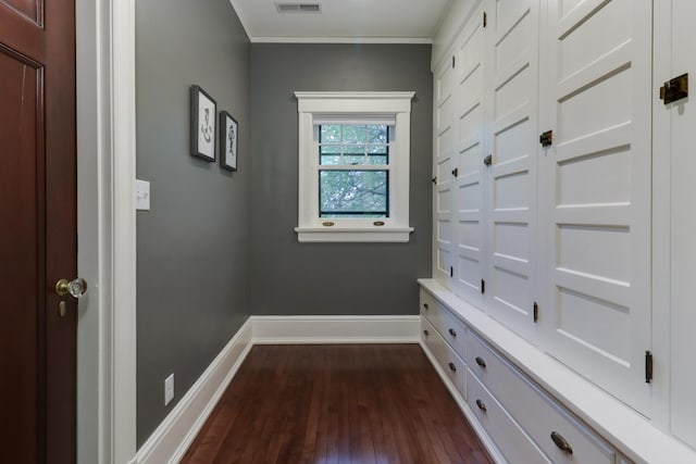 1314 E Washington St, Bloomington, IL 61701 - interior space with baseboards, crown molding, dark wood-style floors, and visible vents
