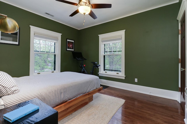 1314 E Washington St, Bloomington, IL 61701 - bedroom with visible vents, ornamental molding, wood finished floors, and multiple windows