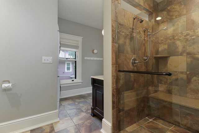 1314 E Washington St, Bloomington, IL 61701 - full bath featuring baseboards, a tile shower, and vanity