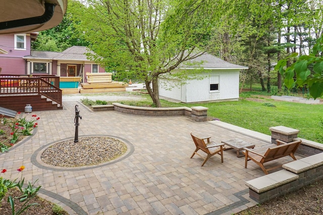 1314 E Washington St, Bloomington, IL 61701 - view of patio with an outdoor structure and a wooden deck