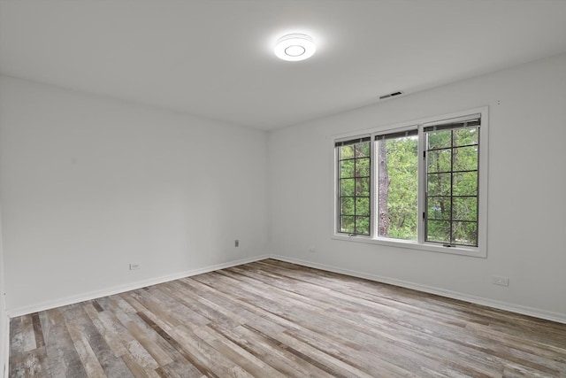 1105 Foxtail Ct Unit 1105, Darien, IL 60561 - spare room featuring visible vents, baseboards, and wood finished floors