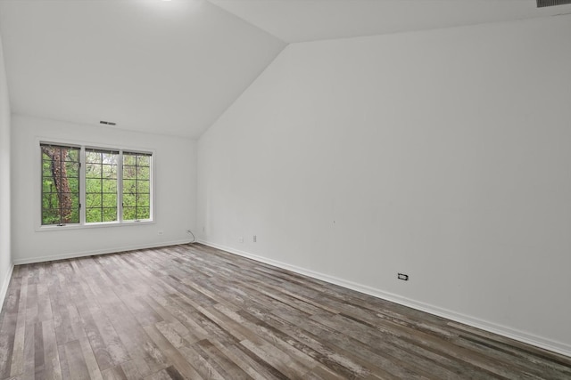 1105 Foxtail Ct Unit 1105, Darien, IL 60561 - spare room with visible vents, baseboards, dark wood finished floors, and lofted ceiling