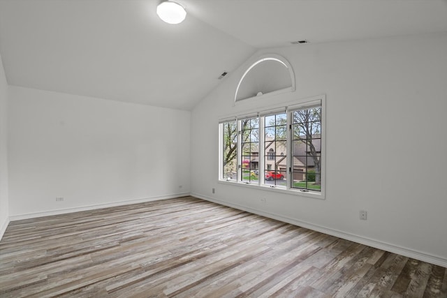 1105 Foxtail Ct Unit 1105, Darien, IL 60561 - unfurnished room with baseboards, visible vents, wood finished floors, and lofted ceiling