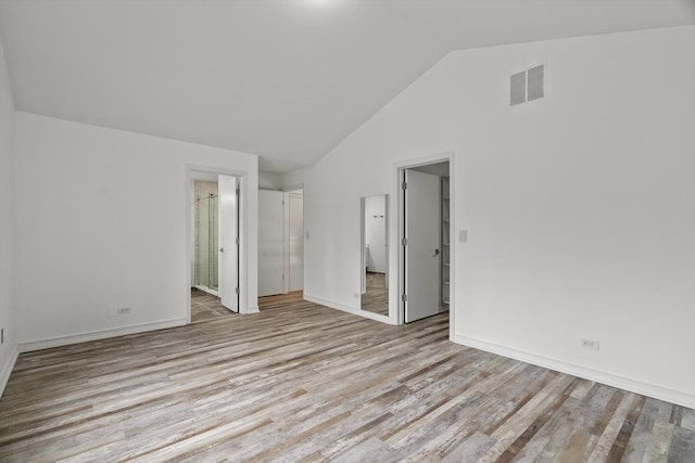 1105 Foxtail Ct Unit 1105, Darien, IL 60561 - unfurnished bedroom with visible vents, lofted ceiling, wood finished floors, baseboards, and ensuite bathroom