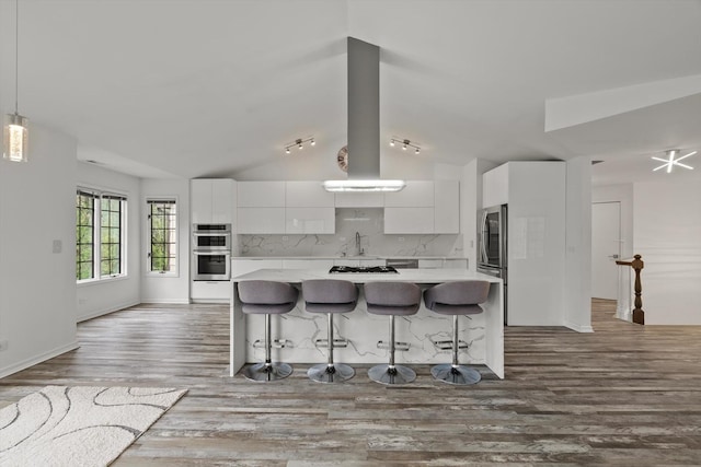 1105 Foxtail Ct Unit 1105, Darien, IL 60561 - kitchen featuring island exhaust hood, light countertops, white cabinets, and vaulted ceiling