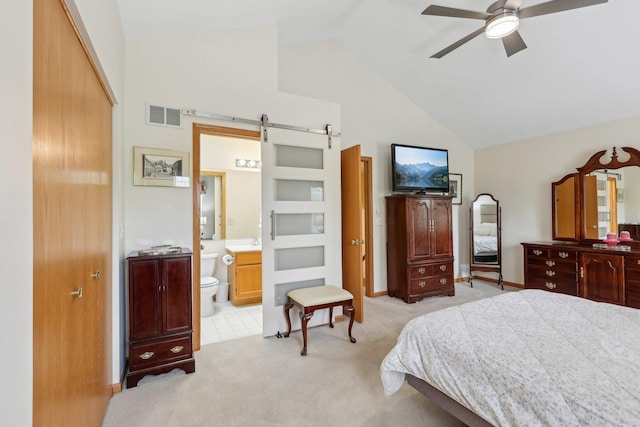 1011 Blackburn Dr, Grayslake, IL 60030 - bedroom with a barn door, light carpet, high vaulted ceiling, and connected bathroom