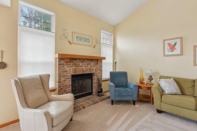 1011 Blackburn Dr, Grayslake, IL 60030 - carpeted living room featuring a fireplace, lofted ceiling, and baseboards