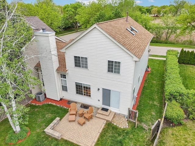 1011 Blackburn Dr, Grayslake, IL 60030 - rear view of property featuring a patio, a chimney, roof with shingles, and central air condition unit