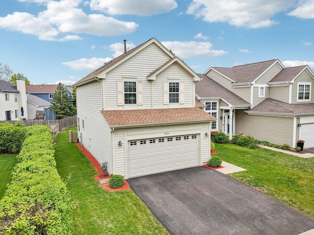 1011 Blackburn Dr, Grayslake, IL 60030 - view of front of home with an attached garage, driveway, and a residential view