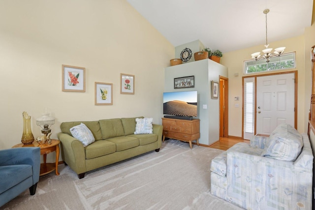 1011 Blackburn Dr, Grayslake, IL 60030 - living area featuring a chandelier, light carpet, and high vaulted ceiling