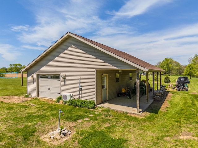 view of home's exterior with a yard, a patio area, and a cooling unit