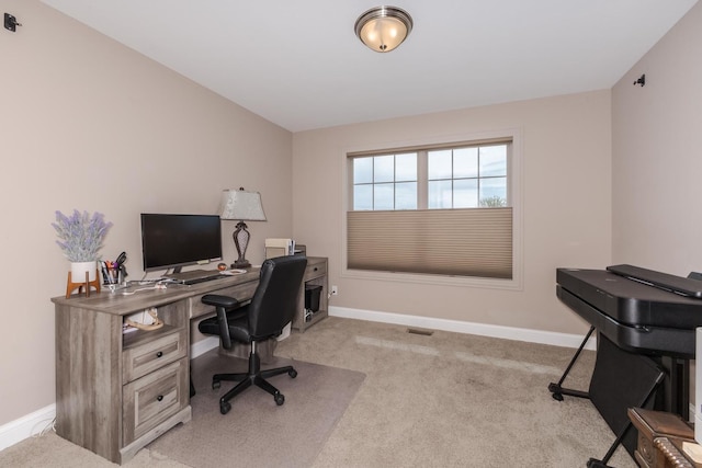 office with light carpet and baseboards
