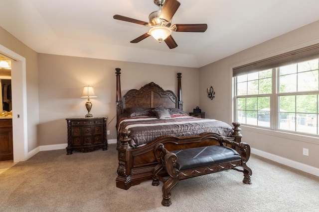 bedroom with light carpet, baseboards, and ceiling fan