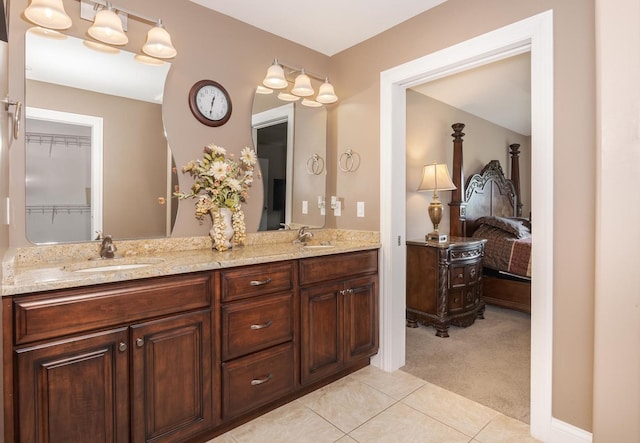 bathroom featuring tile patterned flooring and double vanity