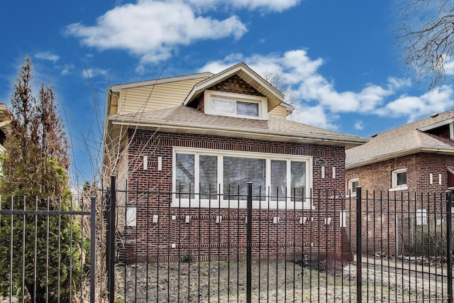 7955 S Paxton Ave, Chicago, IL 60617 - bungalow with brick siding, a shingled roof, and fence