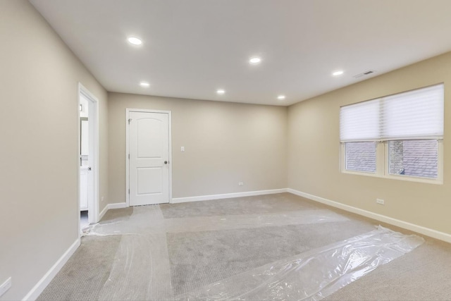 7955 S Paxton Ave, Chicago, IL 60617 - spare room featuring light colored carpet, recessed lighting, baseboards, and visible vents