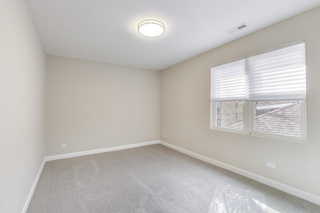 7955 S Paxton Ave, Chicago, IL 60617 - empty room featuring baseboards, carpet flooring, and visible vents