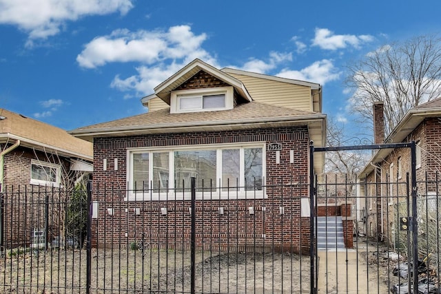 7955 S Paxton Ave, Chicago, IL 60617 - bungalow-style home with a shingled roof, fence private yard, and brick siding