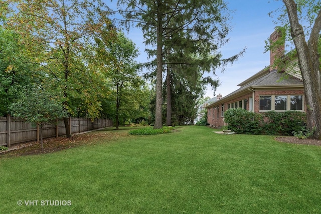 view of yard featuring fence