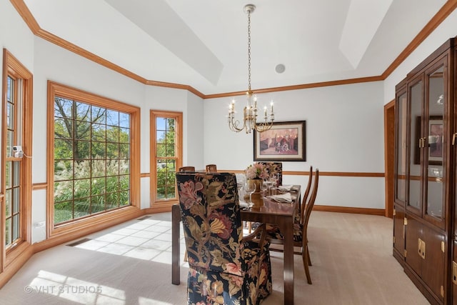 dining room featuring an inviting chandelier, crown molding, baseboards, light colored carpet, and vaulted ceiling