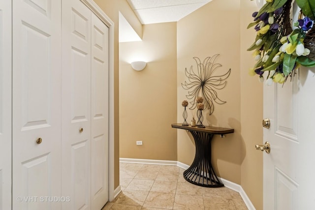 hallway featuring baseboards