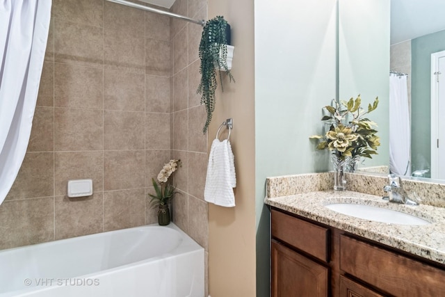 full bath featuring vanity, a shower with shower curtain, and a bathtub