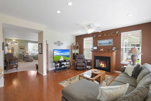 12951 Bull Ridge Dr, Huntley, IL 60142 - living area featuring a warm lit fireplace, ceiling fan, wood-type flooring, recessed lighting, and baseboards