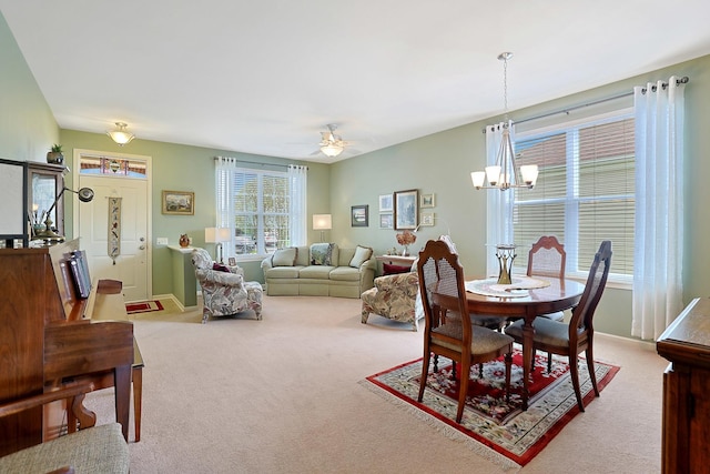12951 Bull Ridge Dr, Huntley, IL 60142 - carpeted dining area with baseboards and ceiling fan with notable chandelier